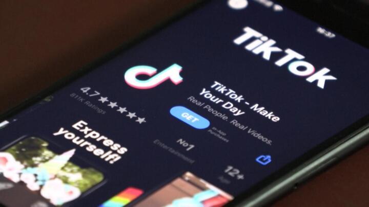 The TikTok app is shown on the screen of a smartphone.